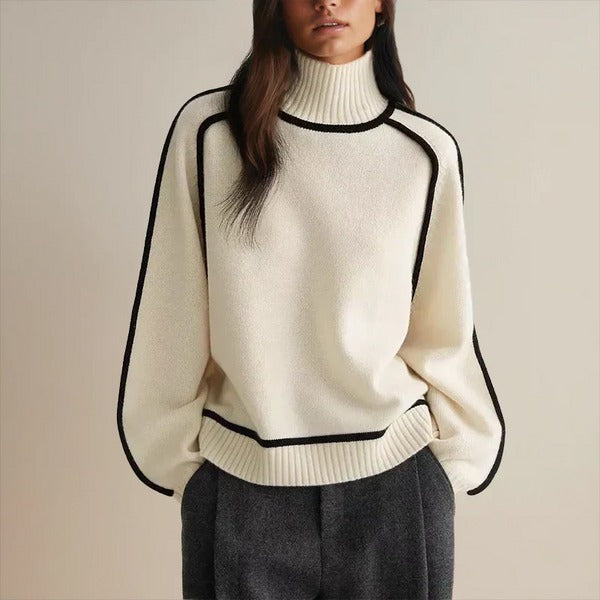 PULL CONTEMPORAIN À COL MONTANT ET FINITIONS NOIRES
