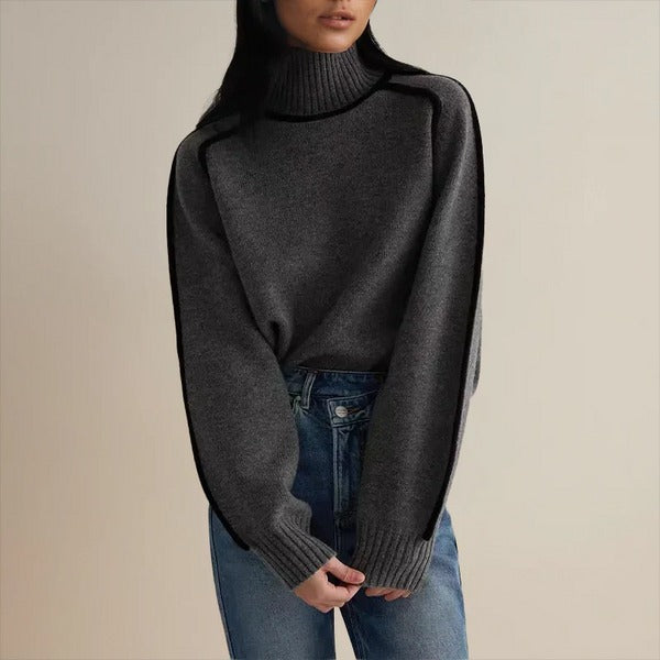 PULL CONTEMPORAIN À COL MONTANT ET FINITIONS NOIRES